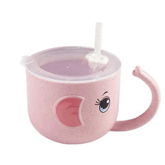 Children's pink cup with a lid and straw  with eyes and ears and handle looking like an elephant's trunk on a white background