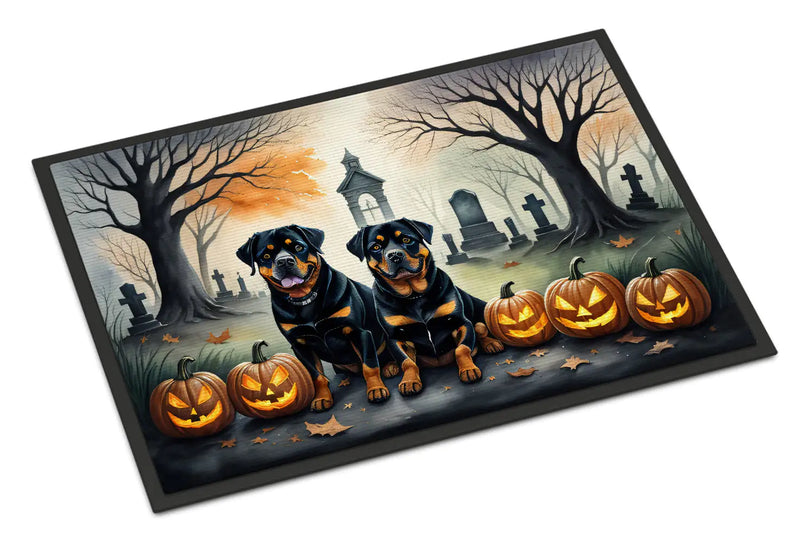 Halloween-themed doormat with two Rottweilers and pumpkins in a cemetery setting.