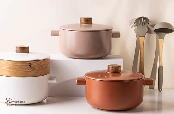 Set of ceramic Morandi pots in different colors and wooden handles on lids
