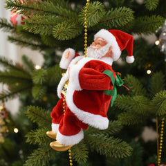 Decorative Santa Claus figure with a green sack hanging on a Christmas tree