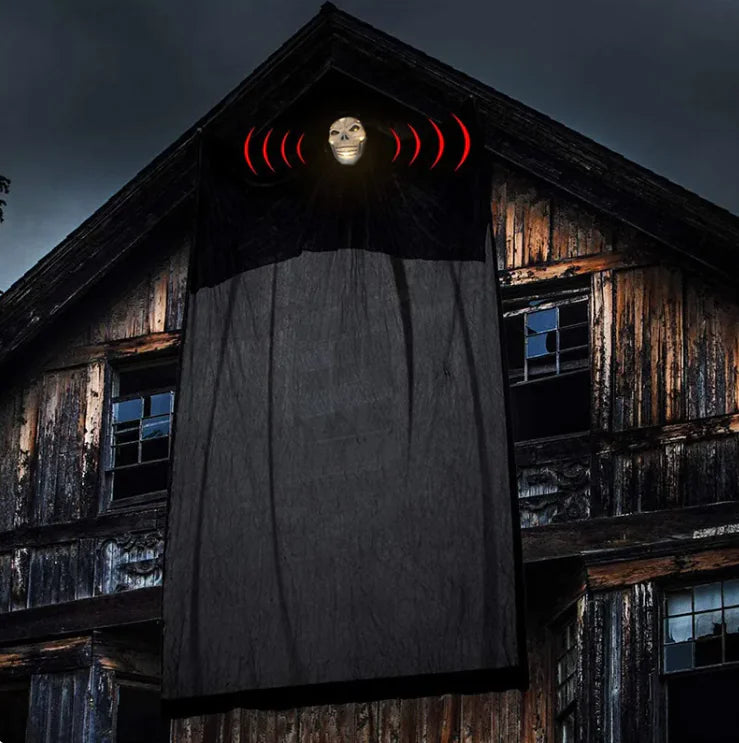 LED Hanging Skull Ghost Halloween Decor with lighted head and long black fabric body.