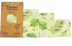Beeswax food wrap with leaf pattern and packaging on a white background