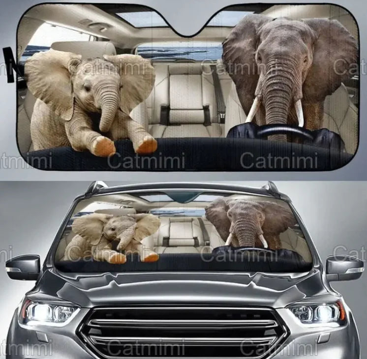 Car sunshades with elephant designs on a vehicle
