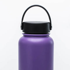 Purple water bottle with a black lid on a white background