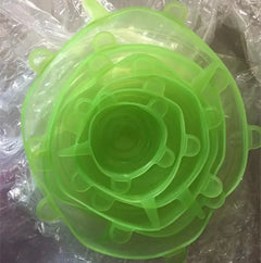 Green silicone lid on a clear plastic background
