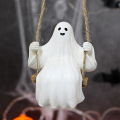 Ghost figurine on a swing against a dark background