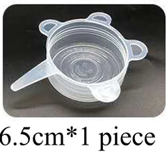 Clear silicone cup with handle on a dark background