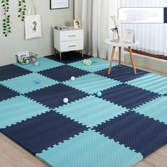 Blue and navy checkered foam mats on a wooden floor with a room setting in the background.