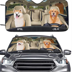Car sunshades with dog illustrations on a vehicle