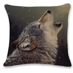 Pillow with a wolf howling design on a dark background