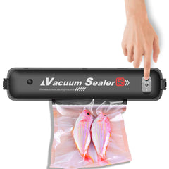 Vacuum sealer with a hand pressing down on it, sealing a bag of fish.