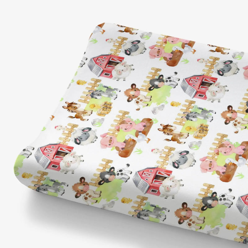 Folded Farm Animals Life Barn Changing Pad Cover for Baby with pigs, sheep, cows and red barns on white sheet