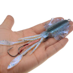 Fishing lure with a hook on a hand against a white background