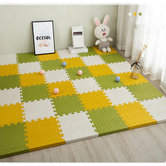 Colorful foam puzzle mat on a wooden floor with a toy rabbit and decor items.
