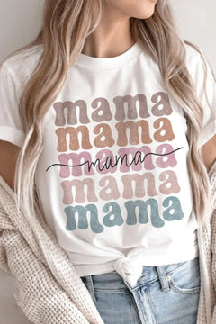 White t-shirt with 'mama' text in various colors worn by a person.