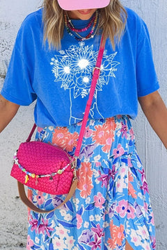 Blue round neck shirt with white drawing of a pair of cowboy boots and a bouquet of flowers coming out of them