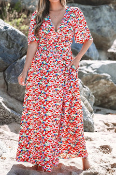Floral Half Sleeve  Deep V Neck Cutout Back Maxi Dress with white background almost entirely covered with bold red, pink, blue flowers with bits of green here and there