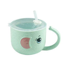 Children's green cup with a lid and straw  with eyes and ears and handle looking like an elephant's trunk on a white background