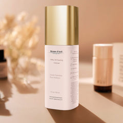 50 ml bottle of Brume d'Avril milky oil foaming cleanser on a beige background