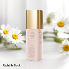 50 ml bottle of Brume d'Avril milky oil foaming cleanser on a white background with daisies behind it