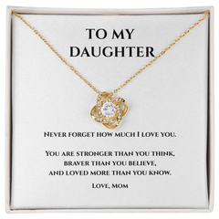 Gold and cubic circonium loveknot necklace w message card that says To My Daughter Never Forget how much I love you. You are stronger than you think, Braver than you believe, and loved more than you know. Love, Mom