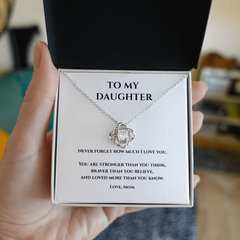 White Gold and cubic circonium loveknot  necklace in gift box w message card that says To My Daughter Never Forget how much I love you. You are stronger than you think, Braver than you believe, and loved more than you know. Love, Mom