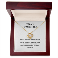 Gold and cubic circonium loveknot  necklace in Luxury Mahagany box w message card that says To My Daughter Never Forget how much I love you. You are stronger than you think, Braver than you believe, and loved more than you know. Love, Mom
