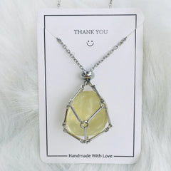 Natural Crystal Pendant Necklace on a 'Thank You' card with a smiley face, on a white fur background.