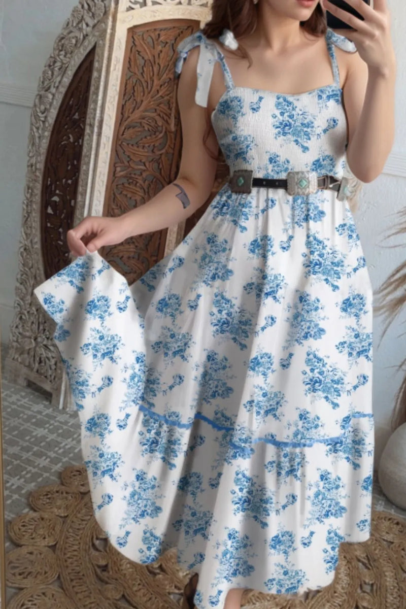 White sundress with tied straps on the shoulders and a full skirt, Blue rose floral pattern