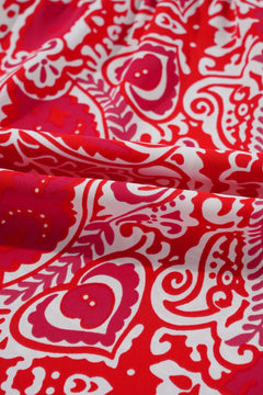 Red fabric with white paisley pattern