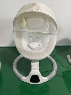 White baby Rocker & Cradle with remote control on a light-colored floor.