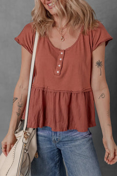 Rust colored top with U neck and four tiny buttons on the front, short sleeves and bottom panel has a darts and gathers to give it a little ruffle