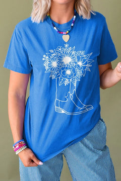 Blue round neck shirt with white drawing of a pair of cowboy boots and a bouquet of flowers coming out of them