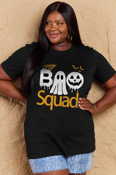 Black round neck tshirt with short sleeves. Hallowee Theme with the word Boo but the first o is a sheet ghost and the second o is a white jack o'lantern and below that is the word Squad in orange. Above the B is an orange spider web and above the pumpkin are three orange flying bat silhouttes