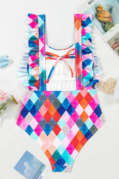 Colorful geometric-patterned swimsuit backview. Ruffled straps and spaghetti strap tie across back