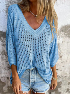 Blue crochet bikini cover up that could double as a summer sweater. three quarter sleeves with V neck