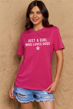 A pink t-shirt with 'Just a Girl Who Loves Dogs' text and a pawprint below in white. Round neck and short sleeves, loose fit