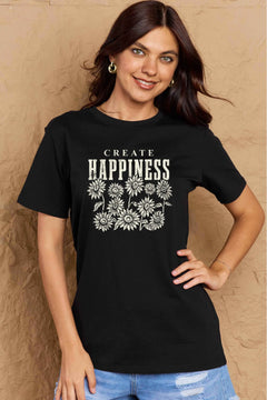 Black Tshirt with round neck and short sleeves, the caption in capital letters says CREATE HAPPINESS, with create being in small letters centered over Happiness. underneath the letters, in white as well, ten flowers arranged in three rows.