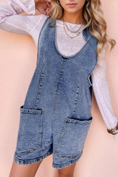 U Neck Patched Pocket Denim Overall shorts. Big front pockets on the thighs and faded blue with double stitched hem and trimming. 