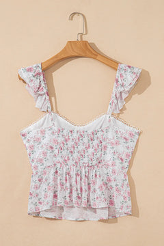Floral top on a wooden hanger against a beige background