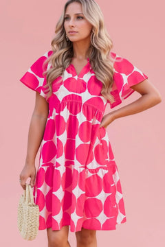 Above the knee dress with giant pink Dots on a white background and v neck