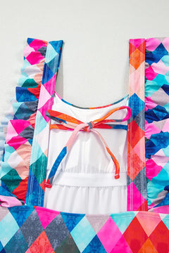 close up of back of bathing suit, colorful diamond pattern, ruffled straps and spaghetti strap tie across the back
