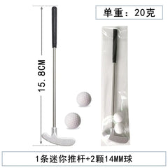 Mini golf putter with two golf balls and packaging on a white background