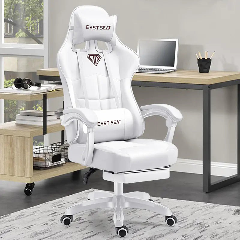 White gaming chair with 'East Seat' branding in a home office setting. Has Head and lumbar back cushion and arm rests.