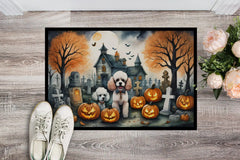 Halloween-themed doormat with Poodles, pumpkins, and a haunted house design.