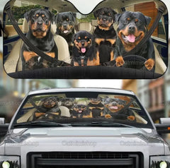 Car sunshade with Rottweiler design on a car interior and exterior.