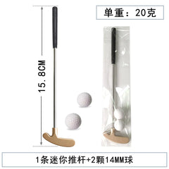 Mini golf putter with two golf balls and packaging on a white background