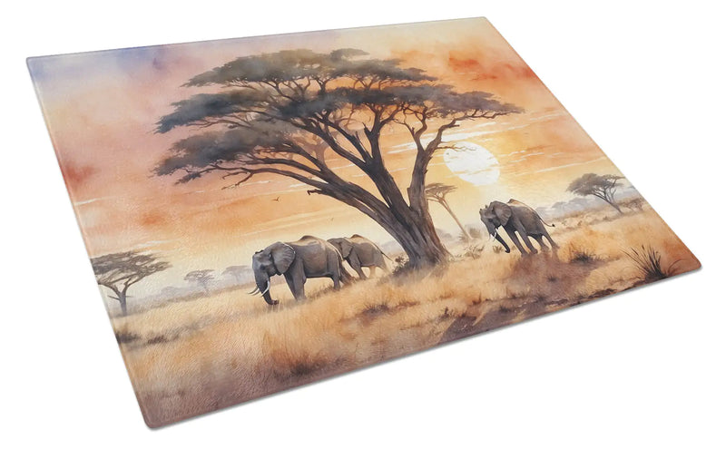 Glass cutting board with elephants and trees design