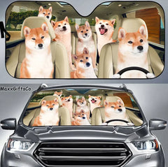 Car sunshade with Shiba Inu dog design and a silver car with the same design.