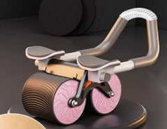 Ab roller with pink wheels on a white background